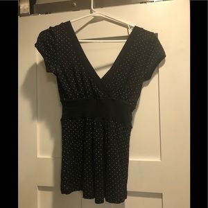 Fitted v-neck top with cap sleeves.